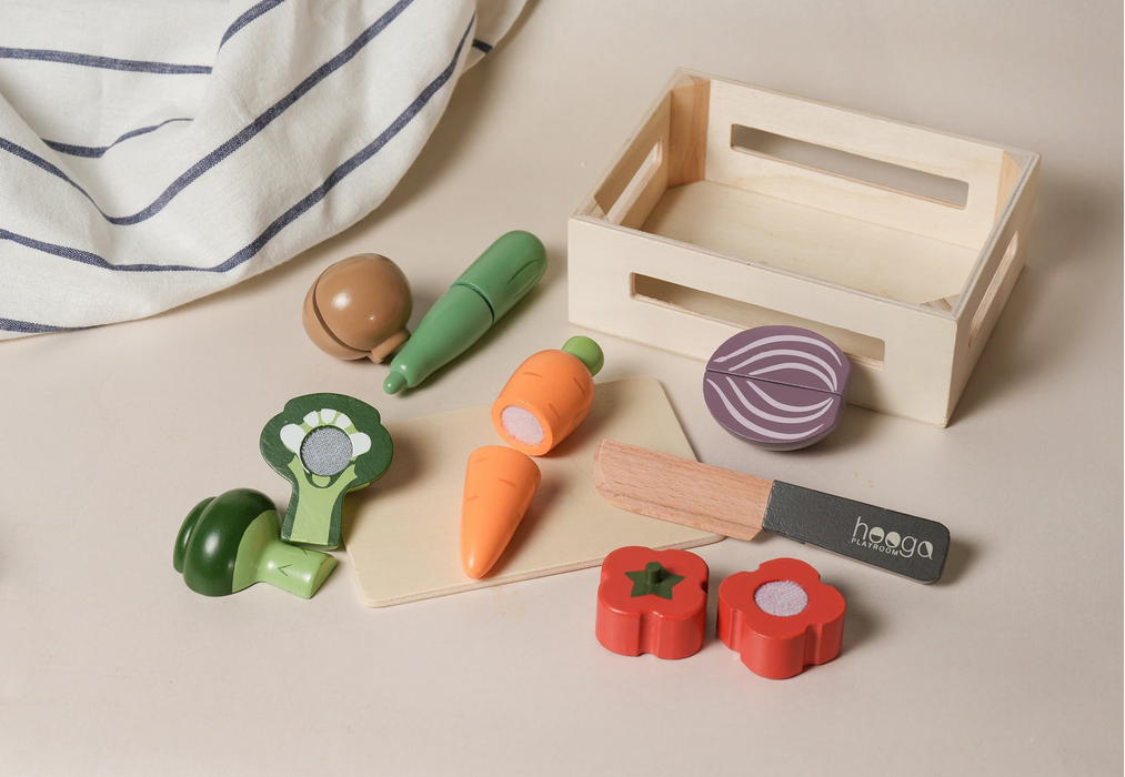 Realistic painted wooden vegetables with a toy knife and basket, perfect for sorting and pretend play.