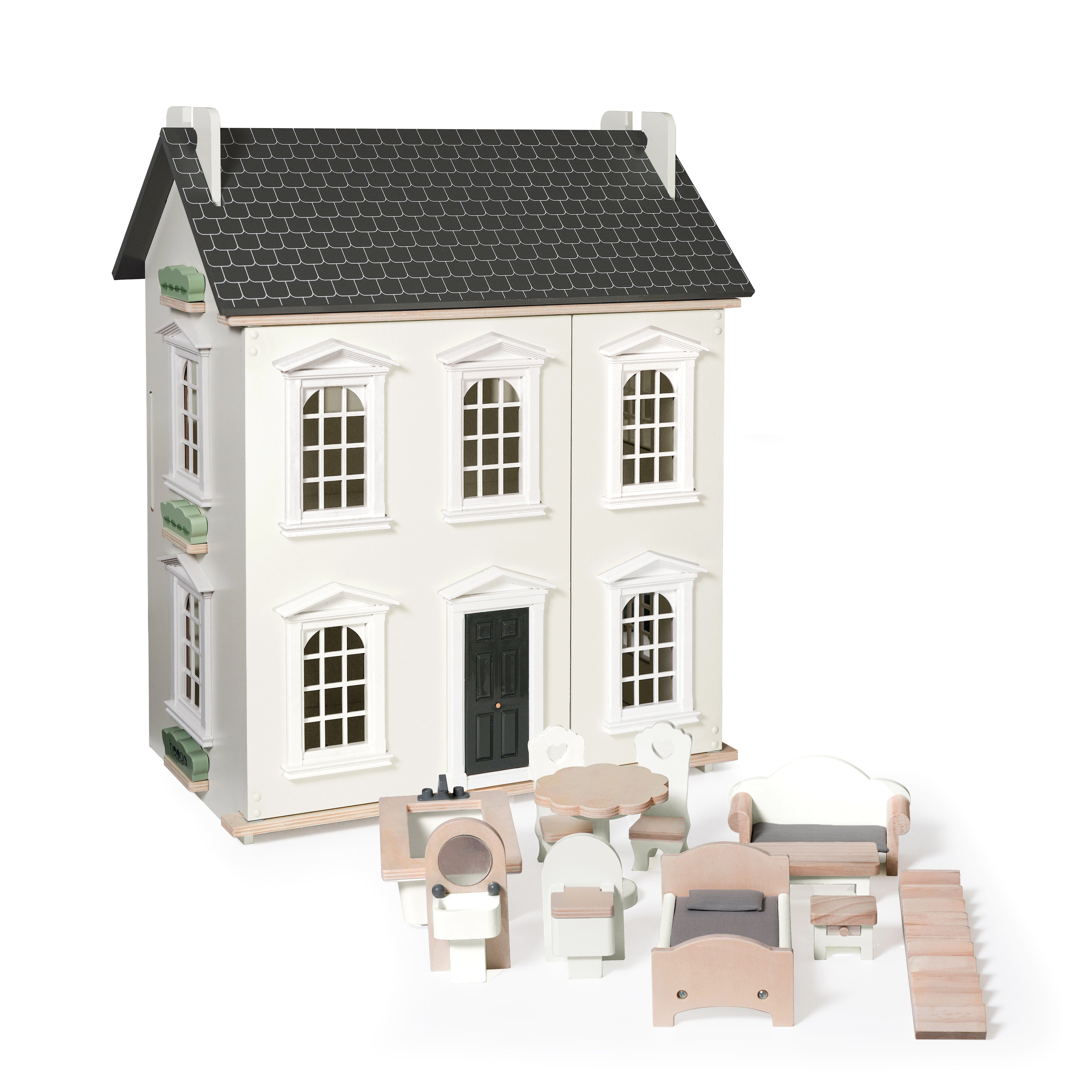 Wooden dollhouse with furniture on a white background